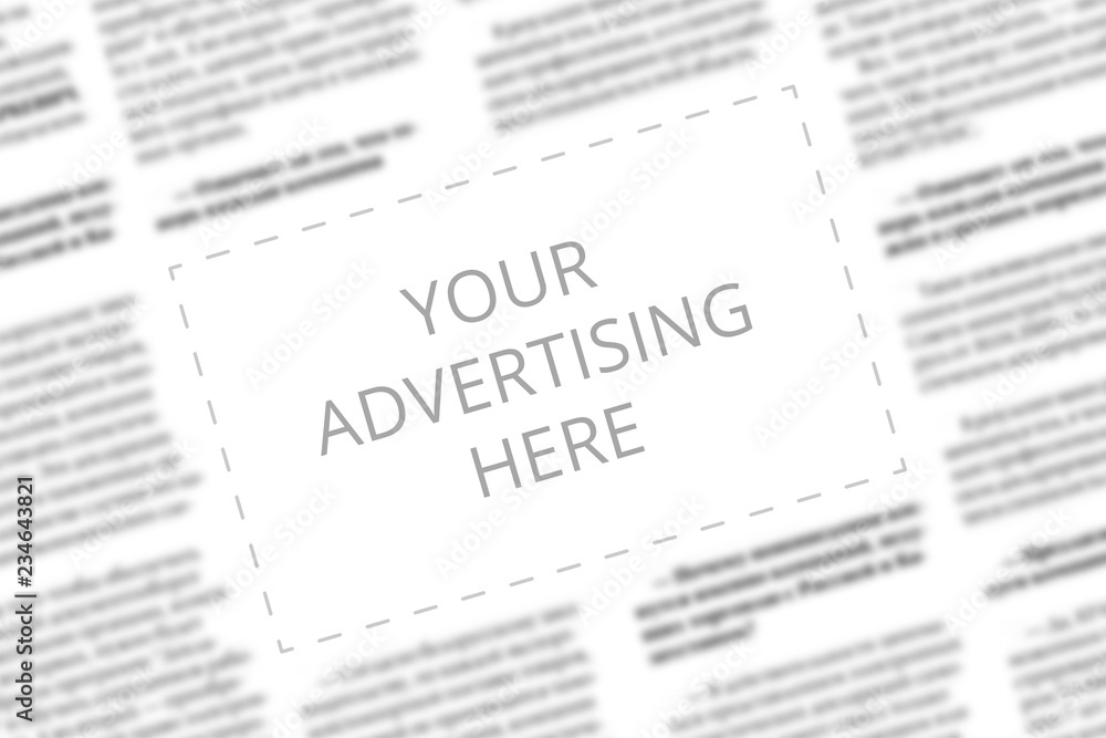 Close up of a copy space with wrtitten words Your Advertising Here on a blurred background of a newspaper. Business concept. Adding ad into paper page. Mockup of a newspaper advertisement column.
