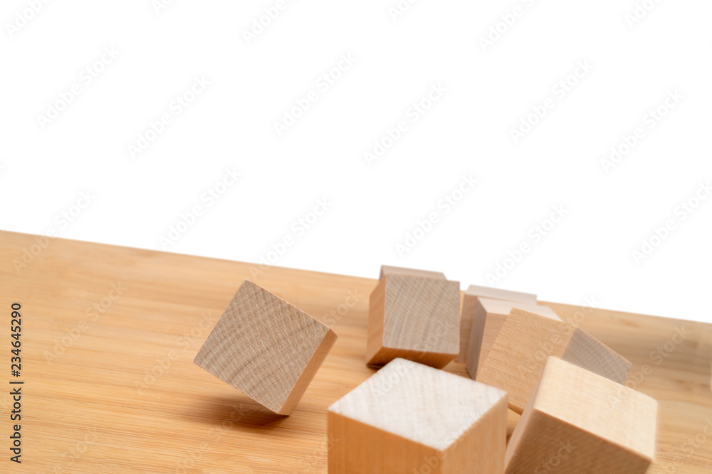 Wooden cubes roll on an inclined plane. Wooden cubes roll on an inclined plane.