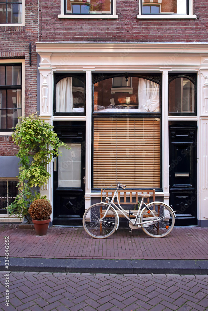 dutch house with bike in amsterdam