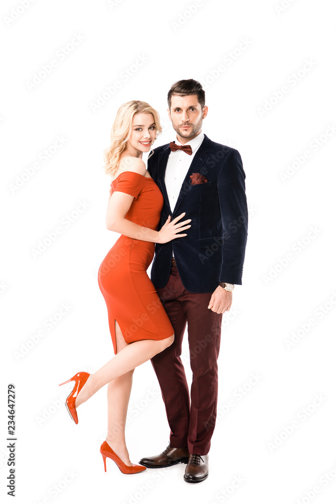 young couple hugging while looking at camera isolated on white young couple hugging while looking at camera isolated on white