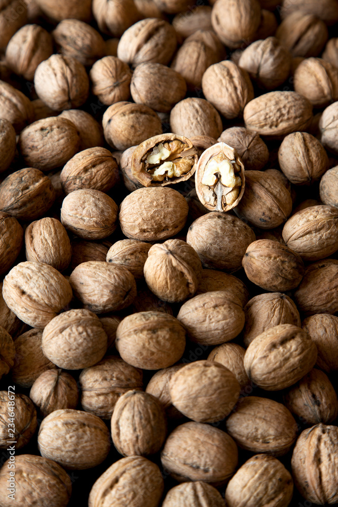 Walnuts on black background, low angle view. Closeup. Walnuts on black background, low angle view. Closeup.