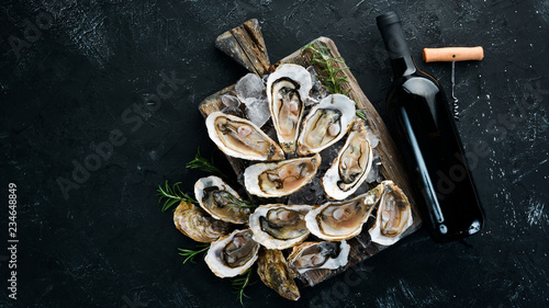 Wallpaper Mural Fresh oysters with ice and red wine. Seafood. Top view. Free copy space. Torontodigital.ca