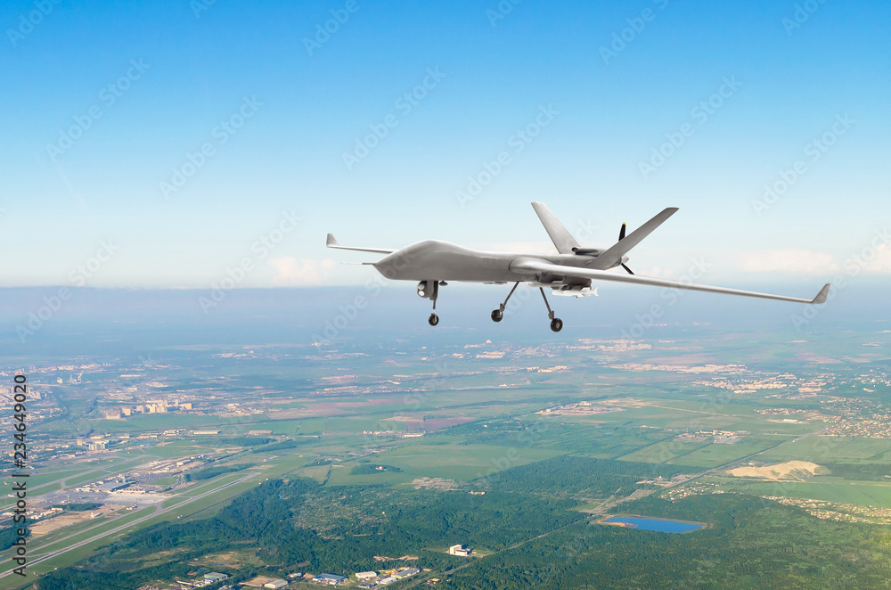 Unmanned military drone uav on patrol air territory at low altitude. Photos  | Adobe Stock