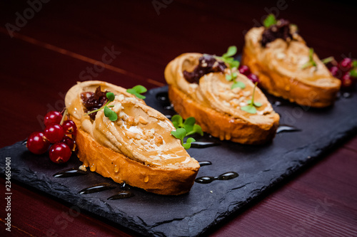 Chicken liver pate with cranberry sauce, served with croutons
