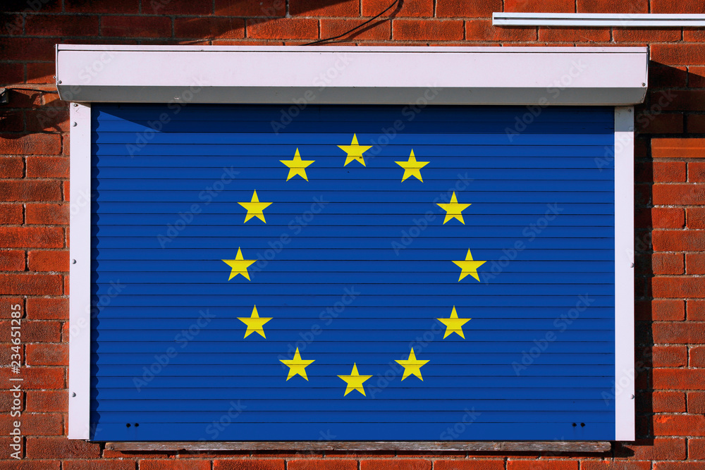European flag on closed security shutters European flag on closed security shutters
