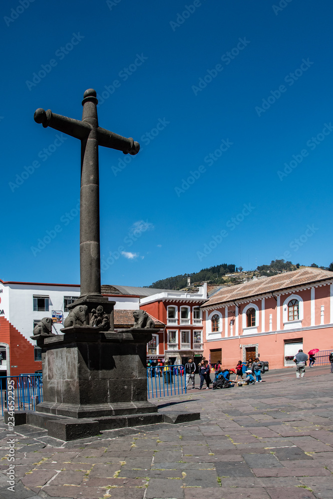 Ancient colonial cross in a square in Quito