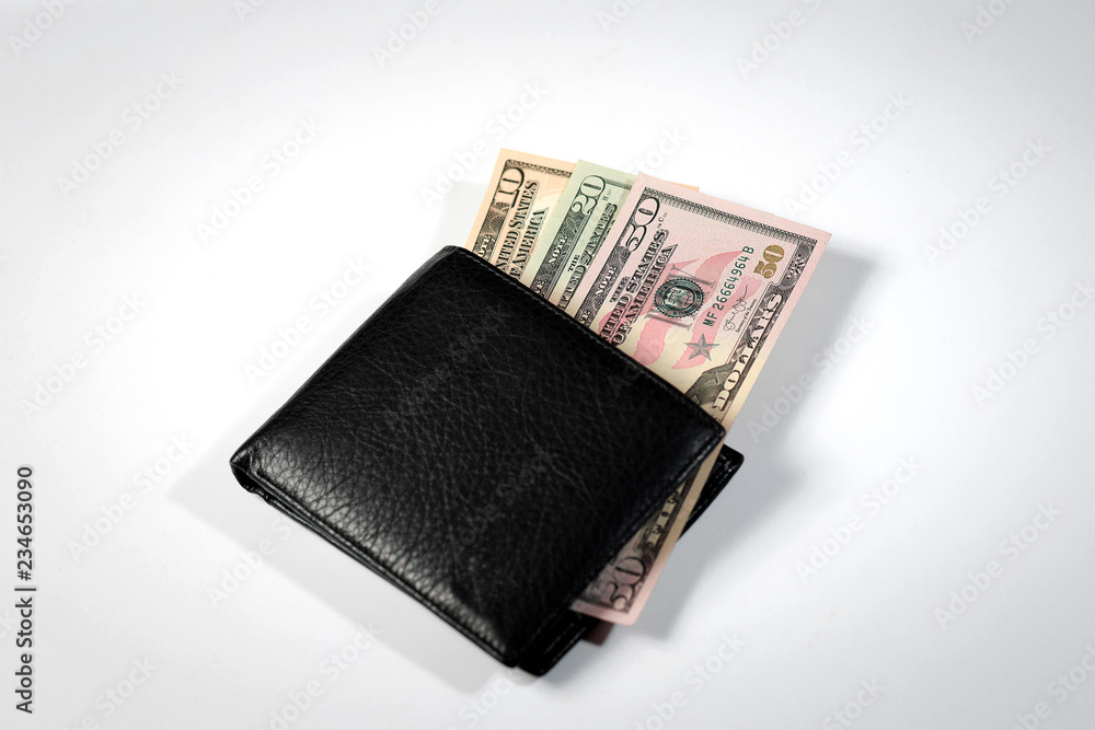 dollar bills in a black men's wallet on a white background and a passport of the Russian Federation dollar bills in a black men's wallet on a white background and a passport of the Russian Federation