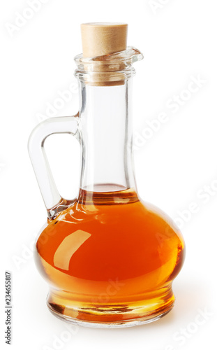 Apple cider vinegar in glass bottle isolated on white background with clipping path