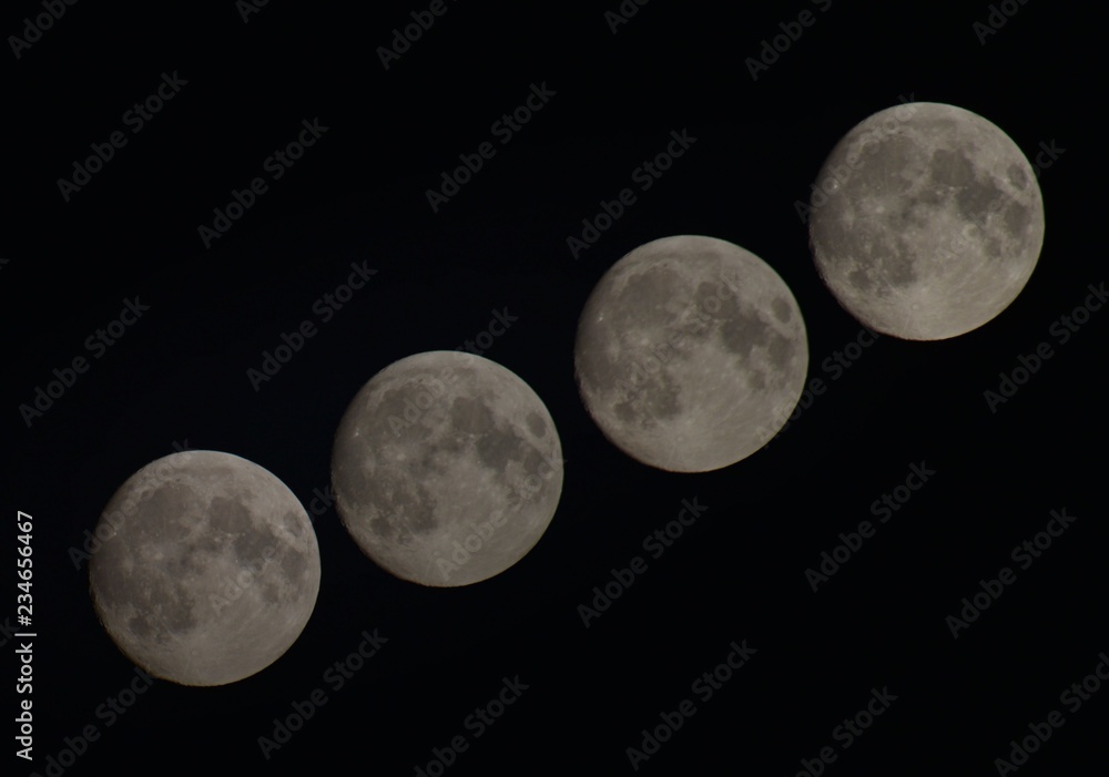 Passage of the moon through a static frame. The image of the Earth satellite on a black background night sky. Full moon. Passage of the moon through a static frame. The image of the Earth satellite on a black background night sky. Full moon.