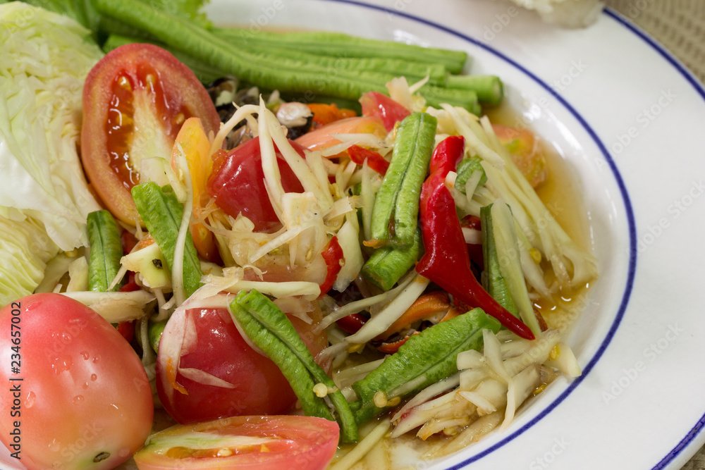 Green papaya Salad (Som Tum Thai) and sticky rice in bamboo container, Thai food Green papaya Salad (Som Tum Thai) and sticky rice in bamboo container, Thai food