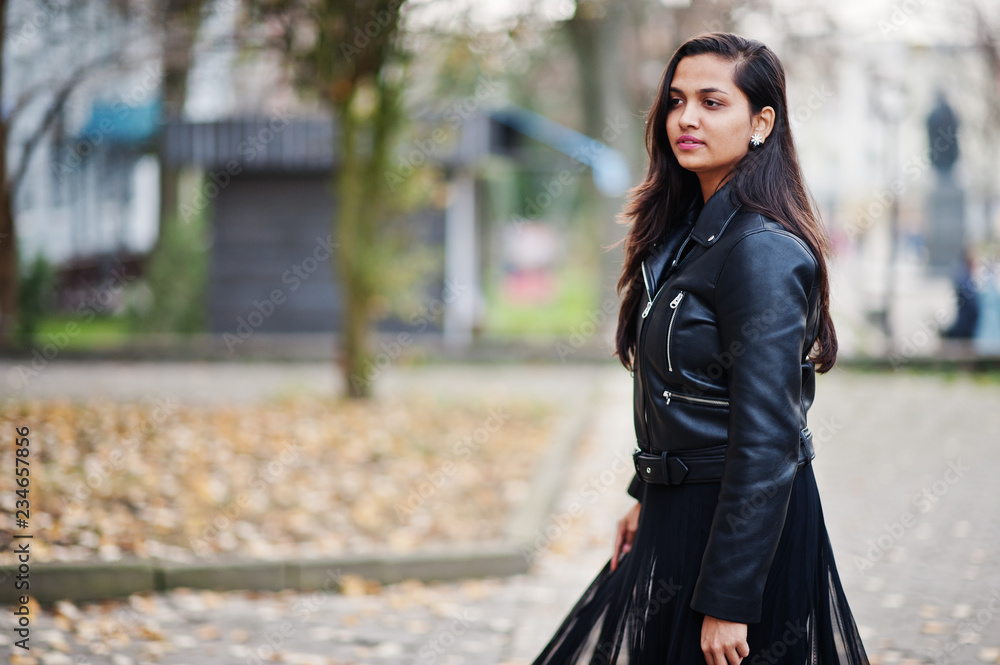 Pretty indian girl in black saree dress and leather jacket posed ...