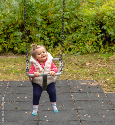 Wallpaper Mural Baby Girl. Park. Smile. Swing. Cute Torontodigital.ca