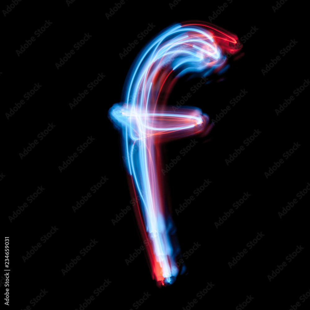 Obraz premium Letter F of the alphabet made from neon sign. The blue light image, long exposure with colored fairy lights, against a black background