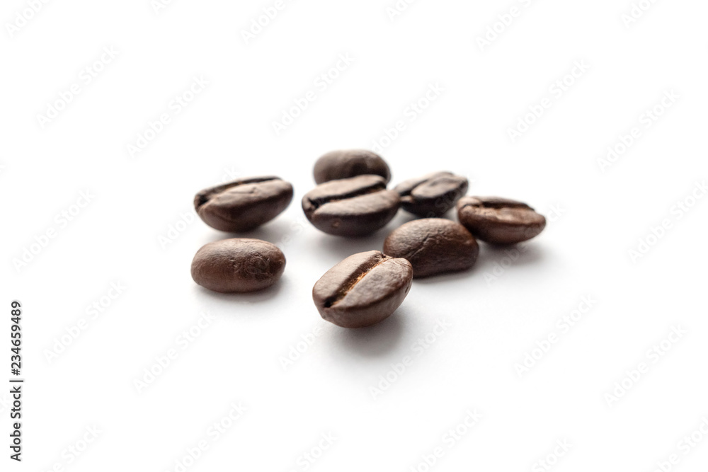 Roasted coffee beans isolated on white background. Roasted coffee beans isolated on white background.