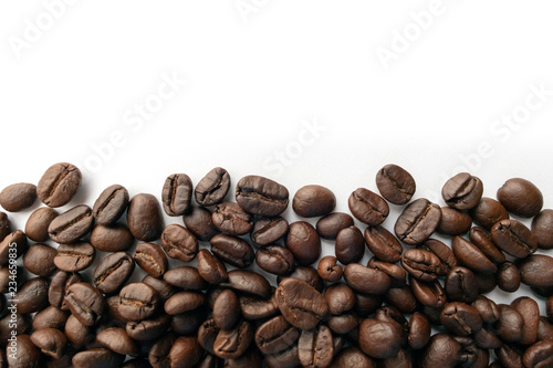 Roasted coffee beans for background.