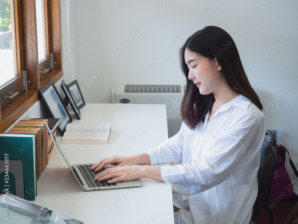 young asian woman working with computer in room young asian woman working with computer in room