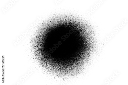 Close-up of a black spray paint spot, isolated on white background. photo