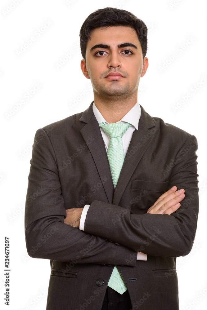 Young handsome Persian businessman looking at camera Young handsome Persian businessman looking at camera