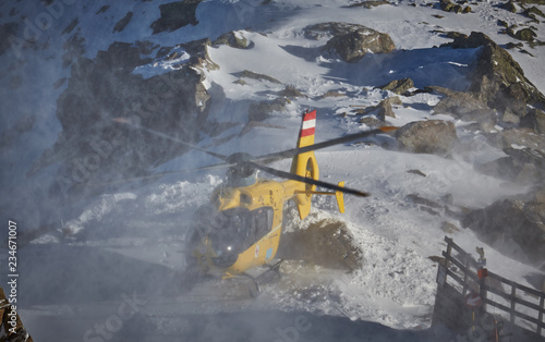 yellow helicopter in the mountains