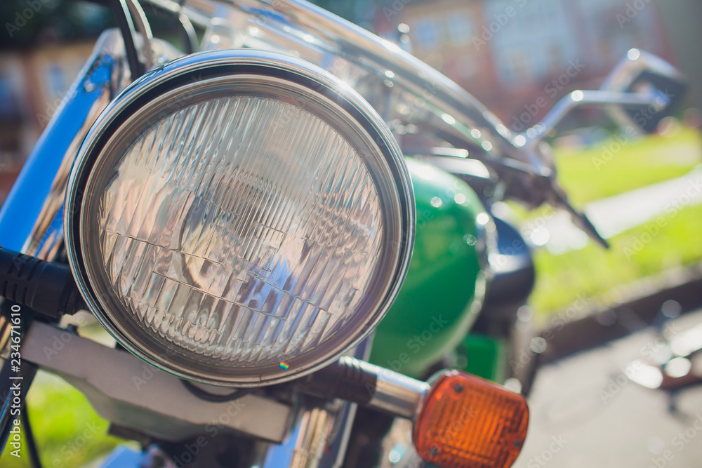 focus on headlamp. Retro motorcycle with headlight - obrazy, fototapety, plakaty 