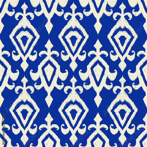 Ikat geometric folklore pattern. photo