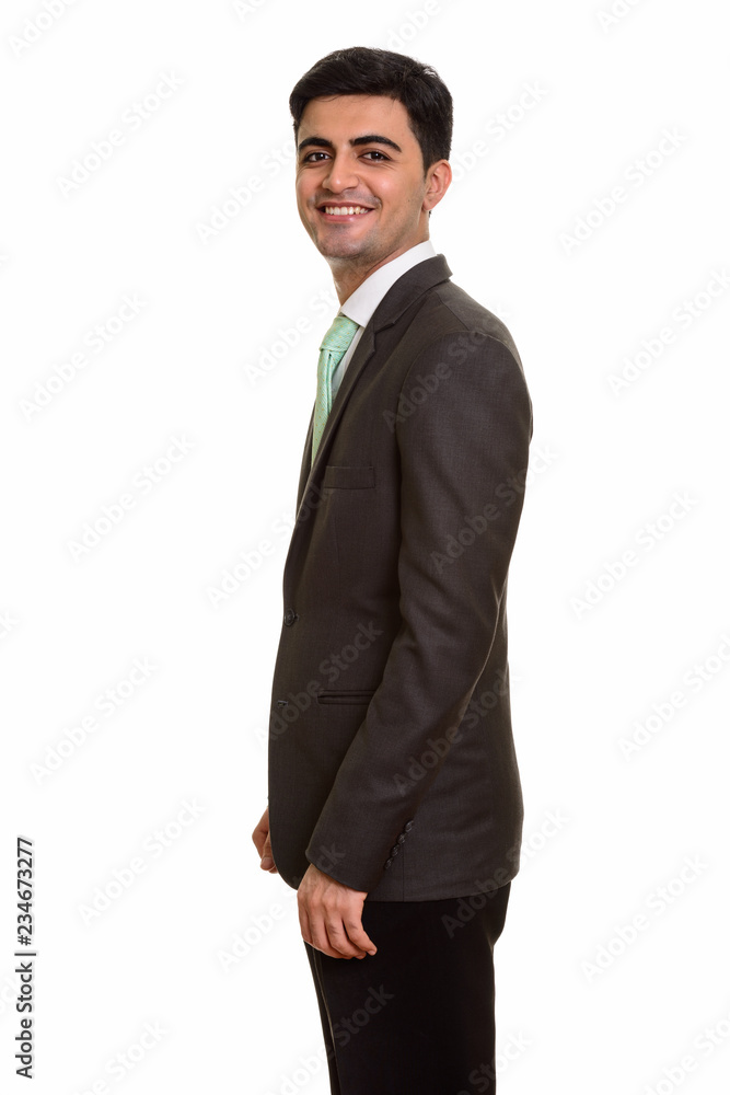 Young happy Persian businessman looking at camera Young happy Persian businessman looking at camera
