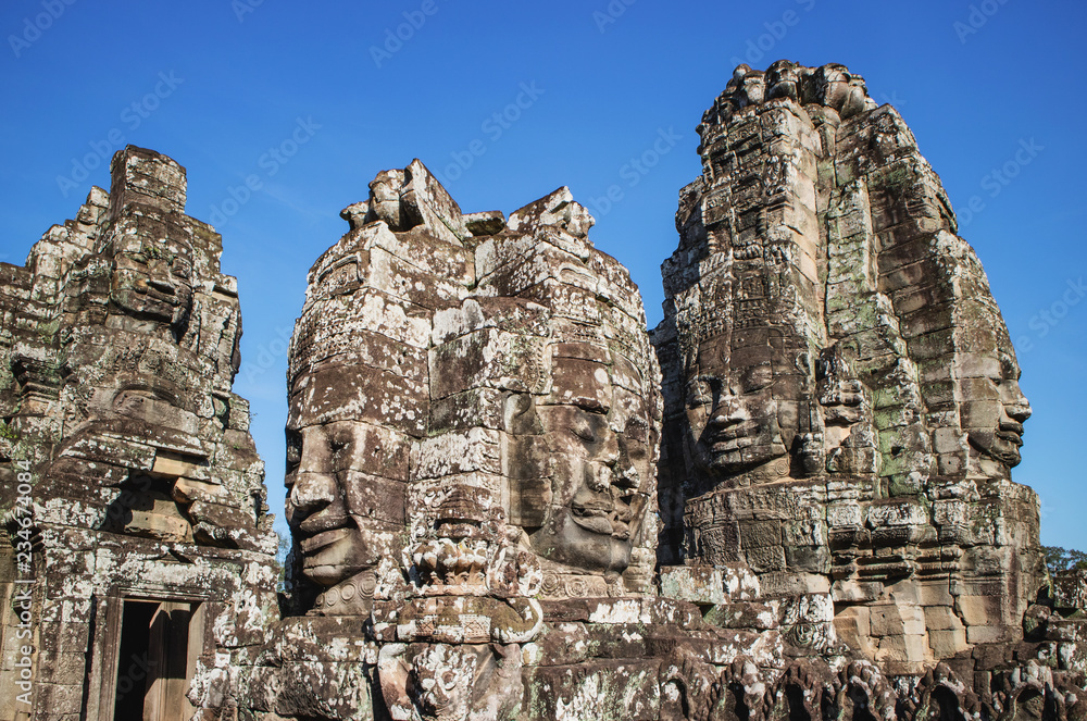 Ancient Buddha Stone Faces of at Bayon Temple, Siem Reap, Cambodia