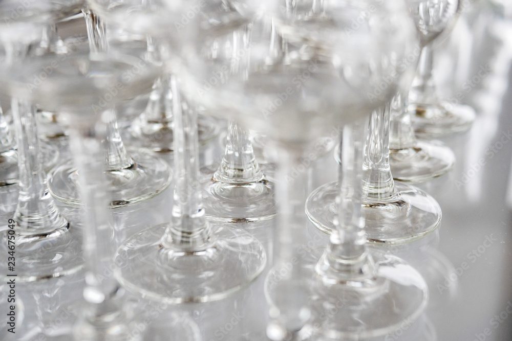 Glass glasses for sparkling wine. On the bar counter, close-up. Glass glasses for sparkling wine. On the bar counter, close-up.