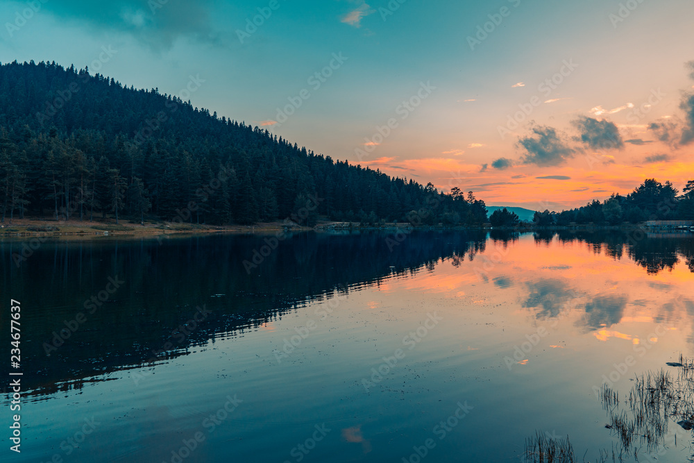 Sunset on the lake, image with orange and teal tone