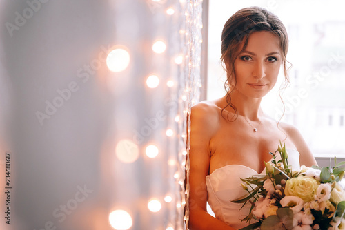 happy and young bride in a gentle dress in eco style.
