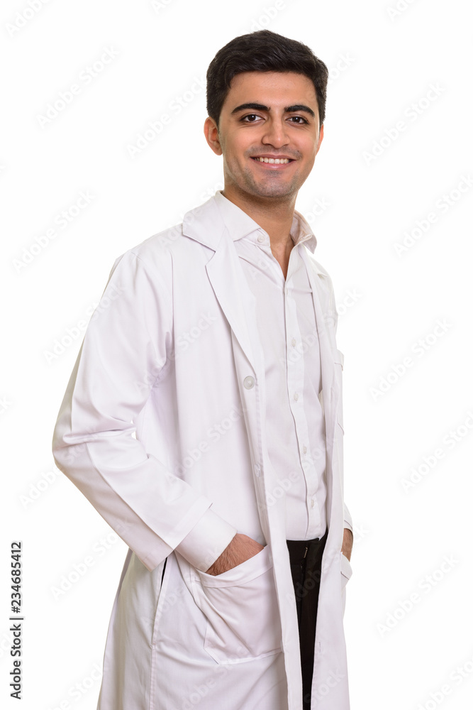 Young happy Persian man doctor looking at camera Young happy Persian man doctor looking at camera