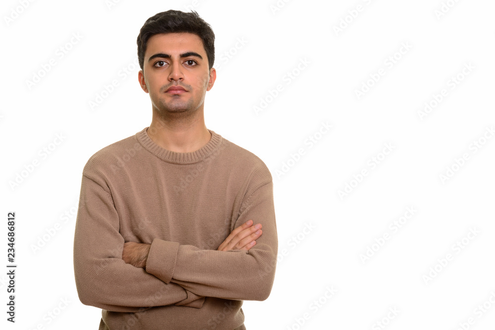 Young handsome Persian man with arms crossed Young handsome Persian man with arms crossed