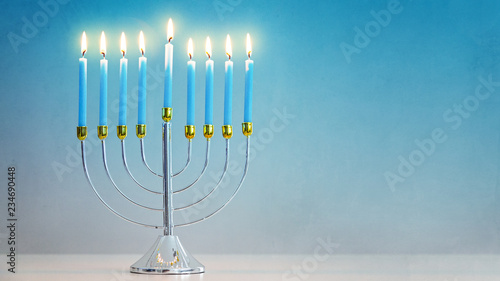 Illuminated Hanukkah Menorah Blue Background