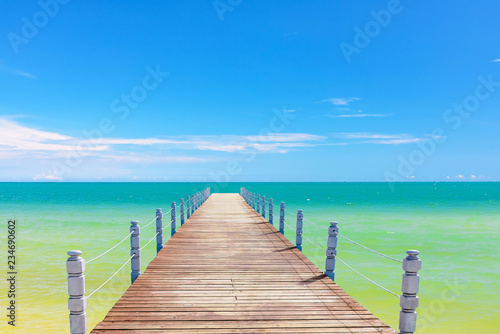 wooden bridge juts out into  of the sea © dbrus