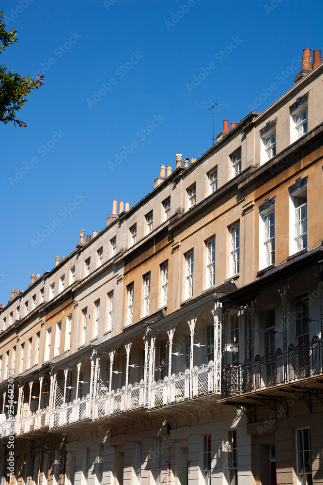 Ornate canopied balconies on historic terraced houses in Caledonia Place, Bristol, UK