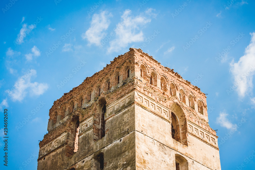 Tower of an ancient fortress against blue sky backgrounds_