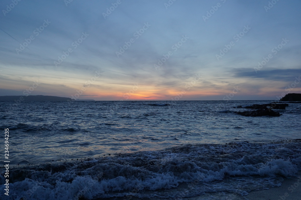 waves at sunset