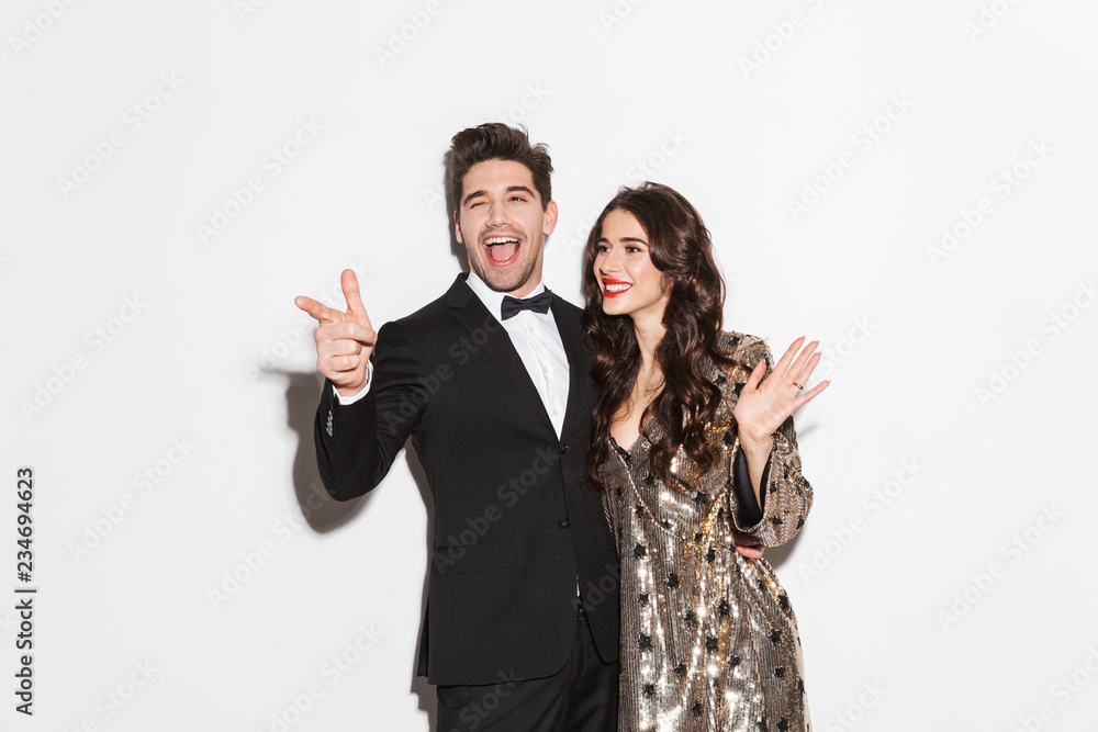 Cheerful young smartly dressed celebrating New Year