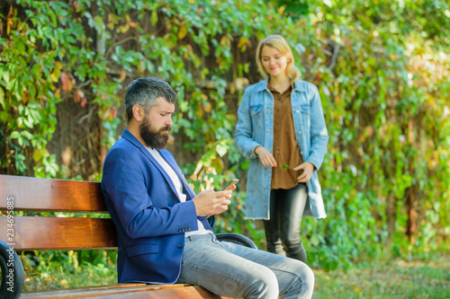 Great date tips. Love relations romantic feelings. Romantic concept. Couple in love romantic date walk nature park background. Man bearded hipster wait girlfriend. Park best place for romantic walk
