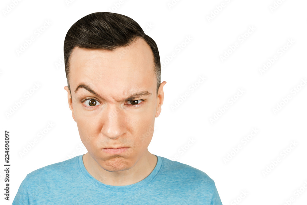Fototapeta premium Portrait of young gloomy serious, severe, grave, earnest, guy isolated on a white background.