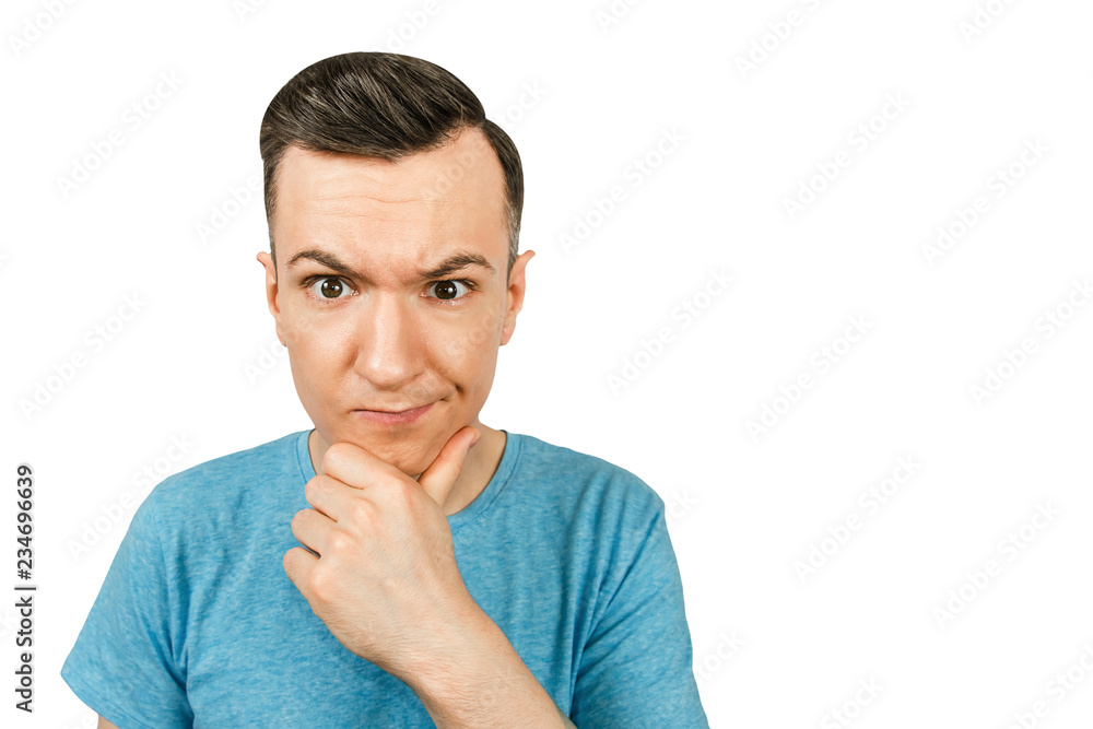 Portrait of young thinking guy with hand at face isolated on a white background. Portrait of young thinking guy with hand at face isolated on a white background.