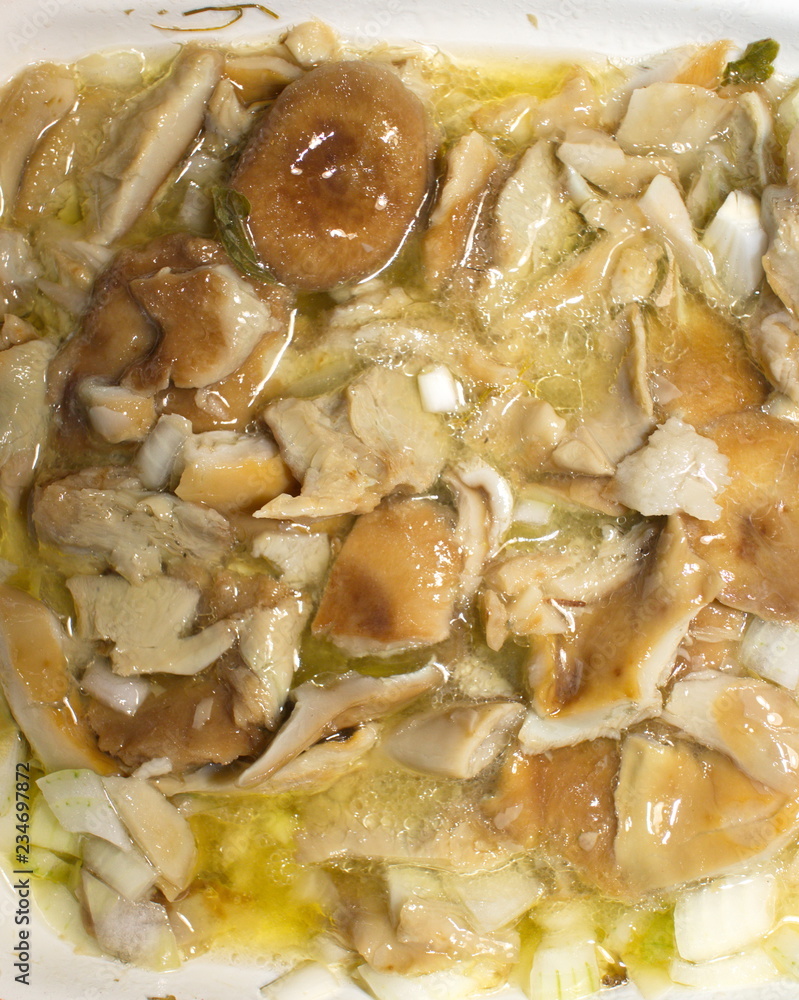 marinated mushrooms in oil on a plate marinated mushrooms in oil on a plate