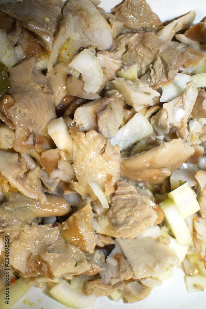 salted mushrooms in sunflower oil close up salted mushrooms in sunflower oil close up