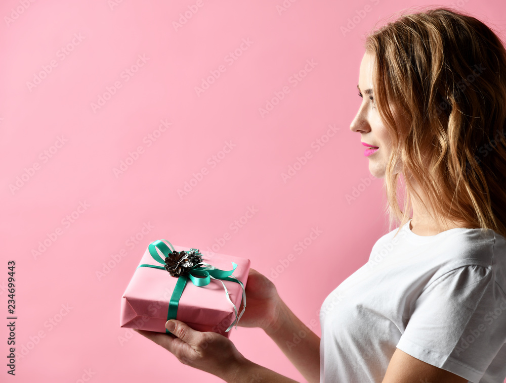 Beautiful woman composition hold pink and pastel green Christmas present gift for new year celebration Beautiful woman composition hold pink and pastel green Christmas present gift for new year celebration