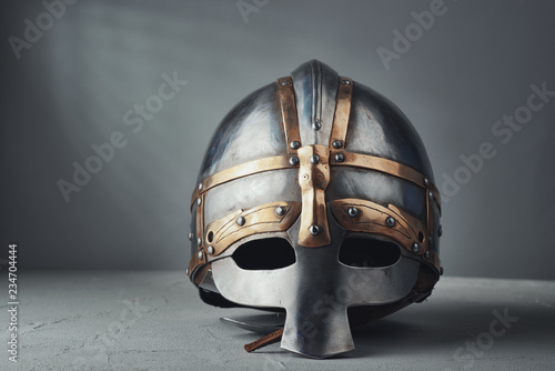 Leinwand Poster Knight's helmet on a gray background