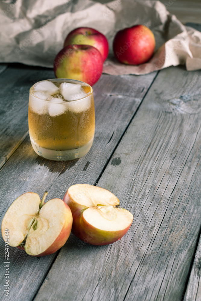 Sliced apples and a glass of fresh juice