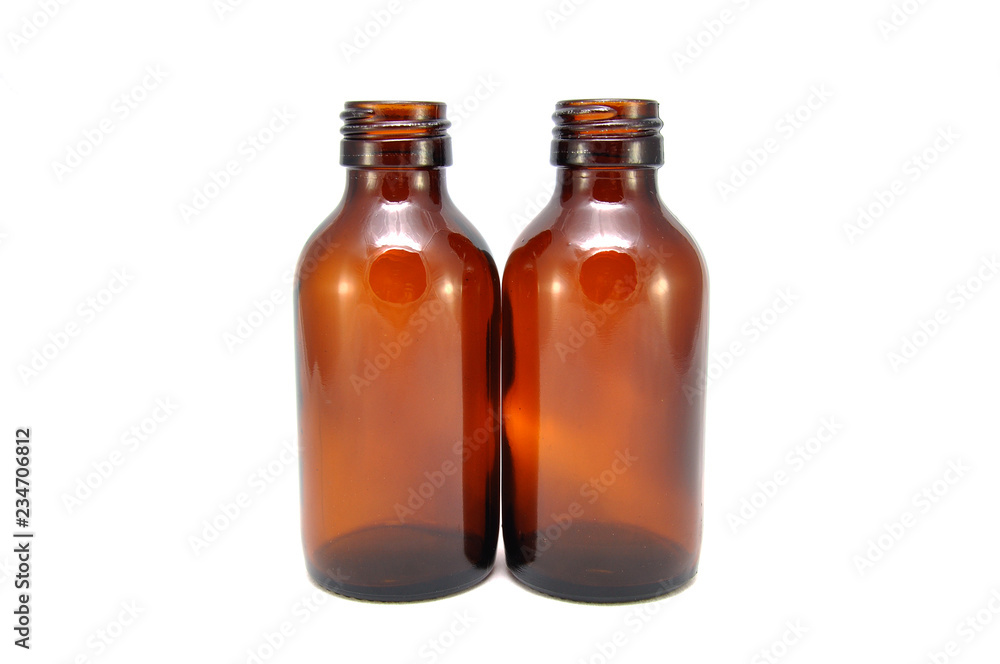 Brown empty bottle on white background close up Brown empty bottle on white background close up