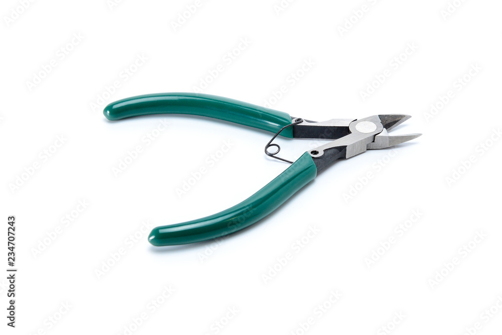 Medium-sized side cutters with green isolated handles on white background. Tool isolated on white, side view. Medium-sized side cutters with green isolated handles on white background. Tool isolated on white, side view.