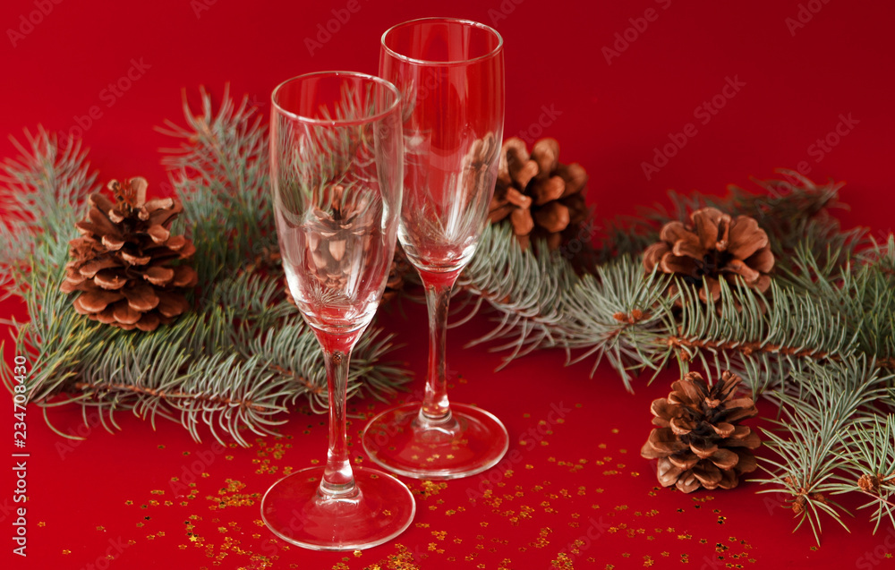 Wineglasses on red christmas background.
Wineglasses on red christmas background.