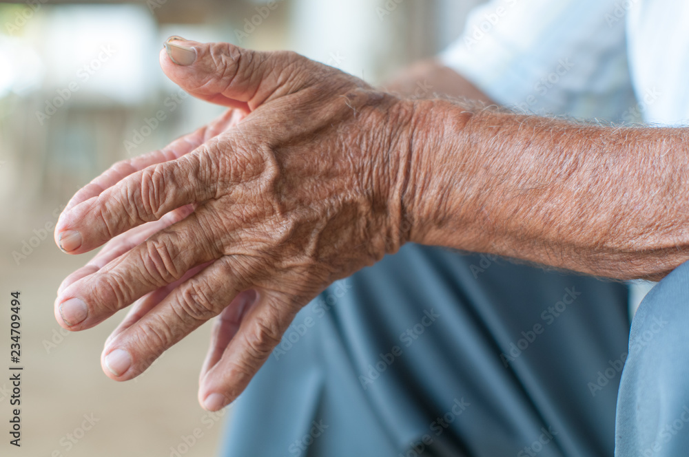 Fototapeta premium Hands of senior man farmer. Colombia